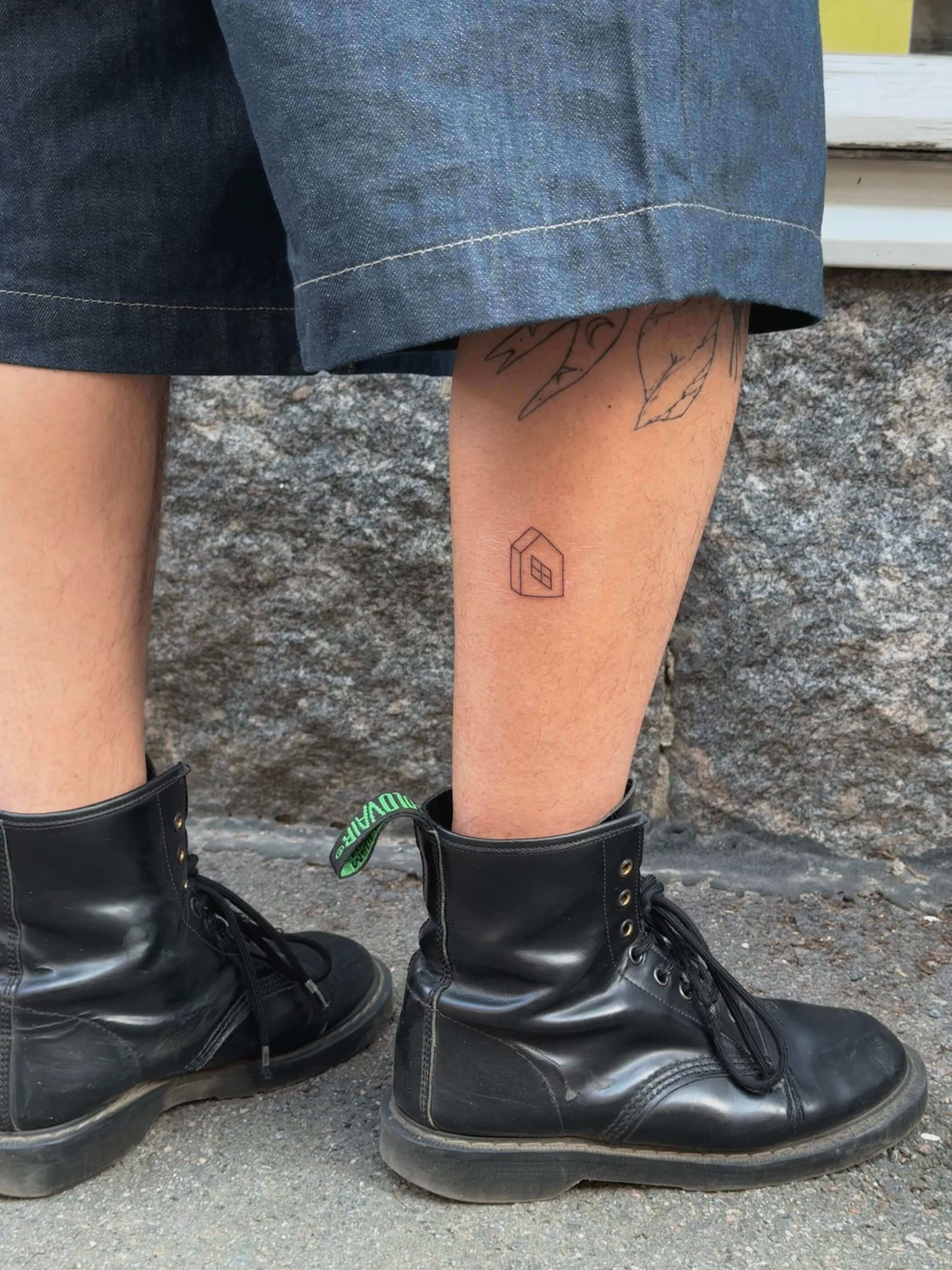 Fine line floral tattoo on forearm by Irka in Helsinki