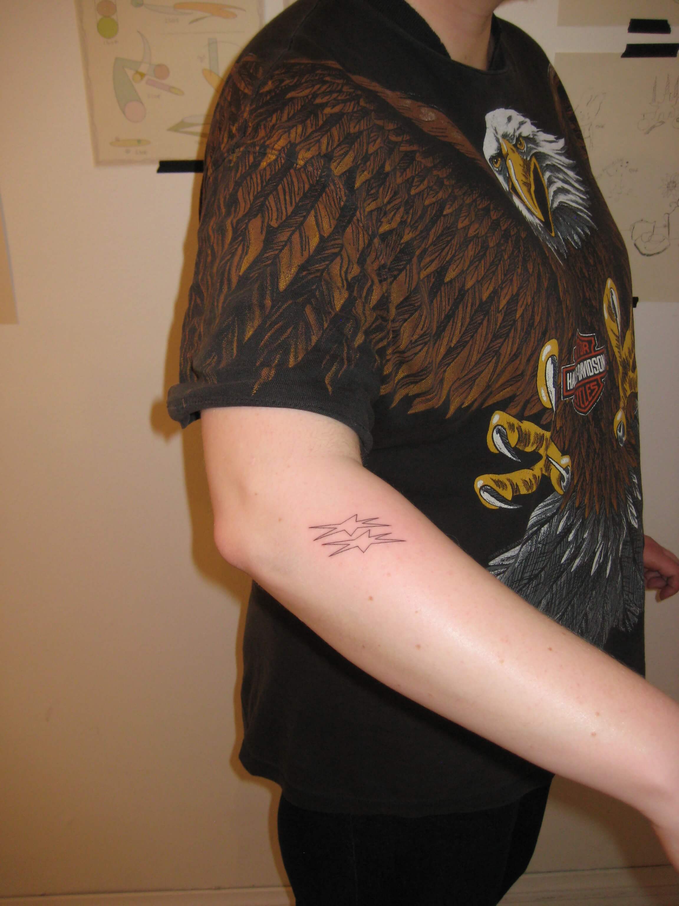 Fine line botanical tattoo on shoulder by Irka in Helsinki