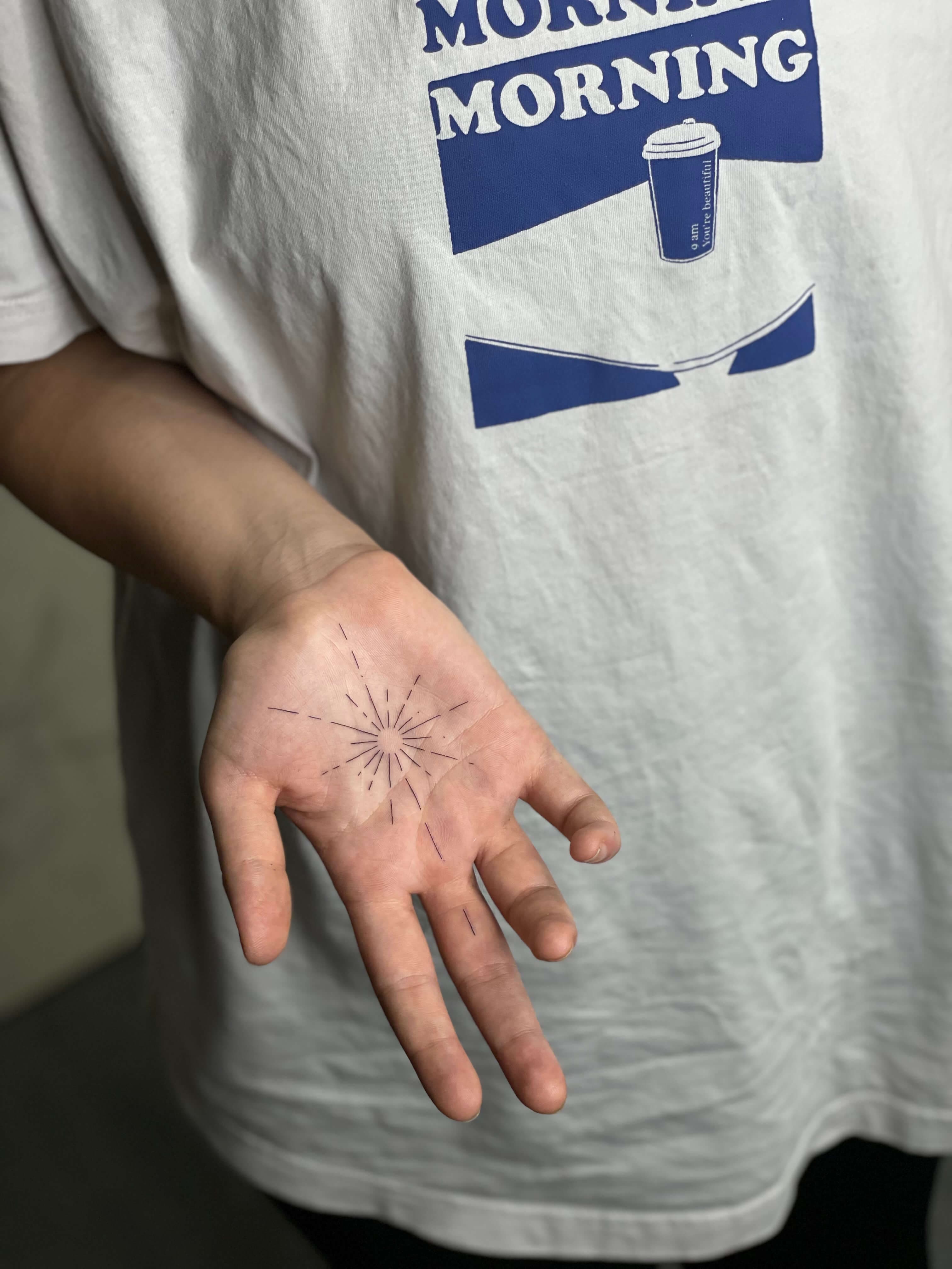 Fine line geometric tattoo on wrist by Irka in Helsinki