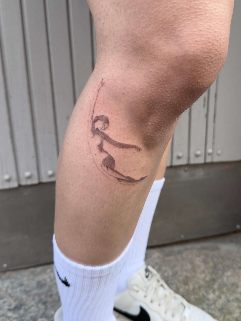 Elegant surfer silhouette tattoo on calf by Irka in Helsinki