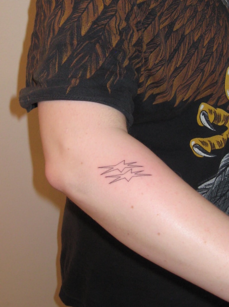 Geometric star burst tattoo on inner arm by Irka in Helsinki