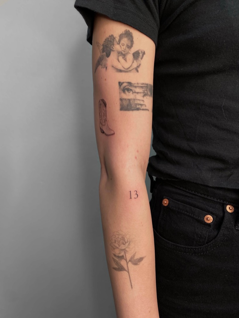 Red ink number 13 tattoo on arm with tattoo sleeve by Irka in Helsinki