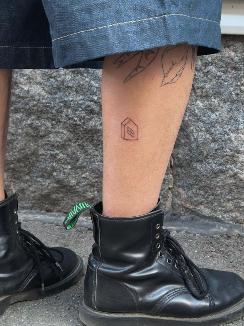 Small geometric house tattoo on shin by Irka in Helsinki